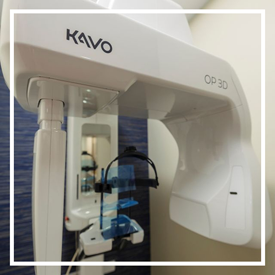 CT cone beam scanner standing against a wall