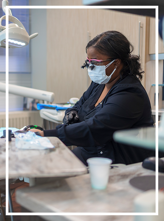 Woman holding her face in pain before seeing an emergency dentist in Washington, DC