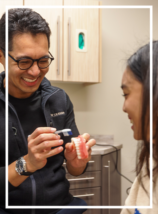 Man smiling in a dental office after gum disease treatment in Washington, DC