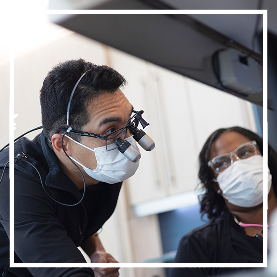 Smiling woman typing on a laptop