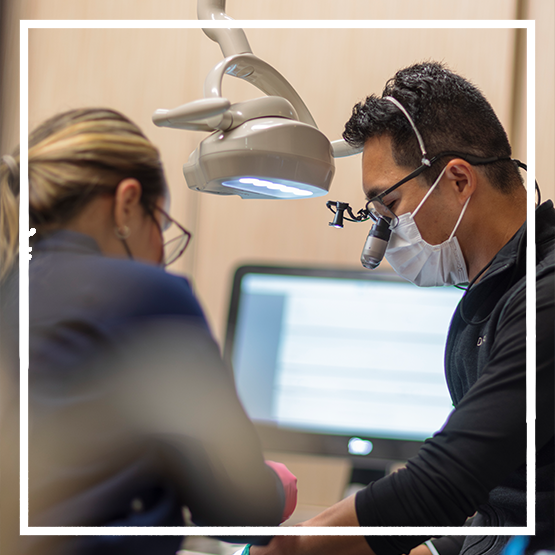 Woman smiling against a purple background