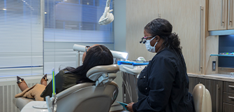 Two women laughing and hugging