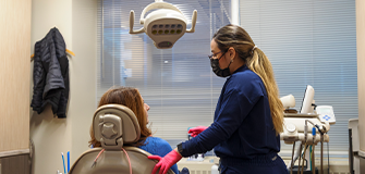 Woman holding her cheek in pain