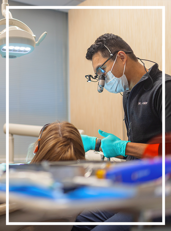 Woman holding the side of her jaw in pain before TMJ treatment in Washington, DC