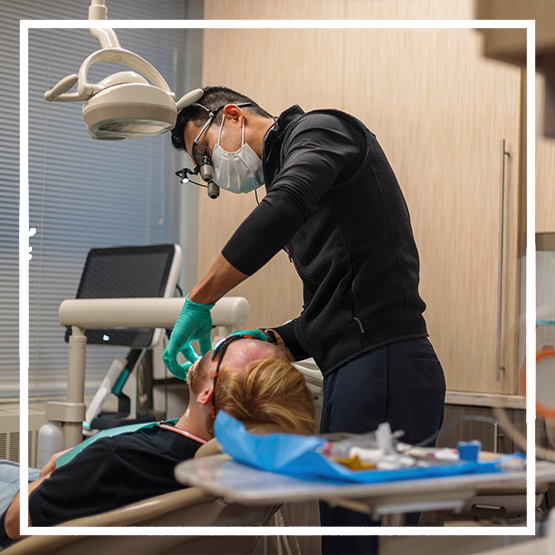 Woman holding the side of her head in pain